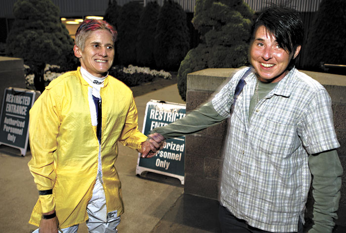 Hoonan-Trujillo (left) is greeted by her wife, Lisa, after riding in last Thursdays third race.