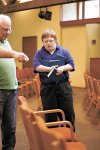 Ron Davids (left), a consultant with AtWork!, helps 21-year-old Kevin Christensen learn to sort bibles and hymnals at  Redmond Presbyterian Church.