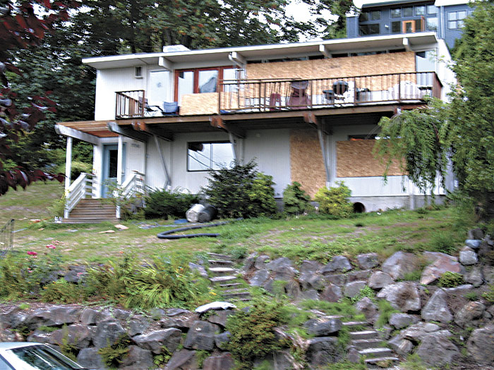 Appleberrys house was still boarded up a month after the SWAT operation.