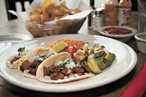 Ignore everything on the table at Laredos except the al pastor and chips.
