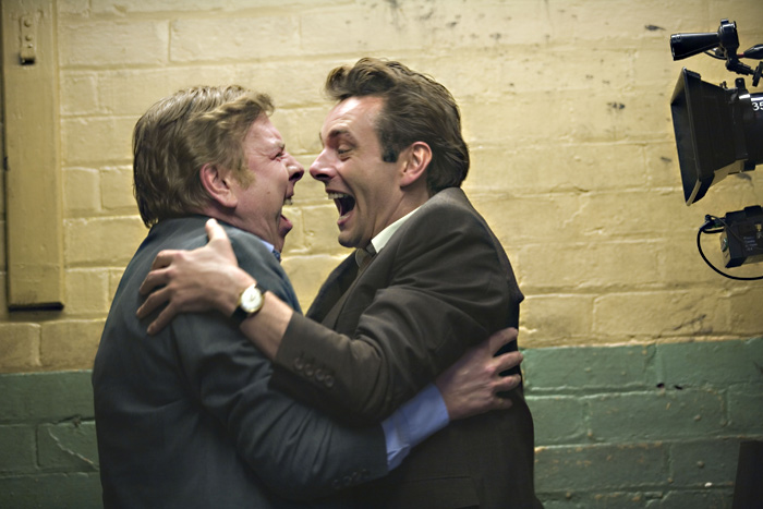 Spall (left) and Sheen celebrate, but not for long.