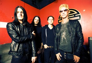 Music and women saved the author (right, seen here with his band, Loaded) from a car-thieving career.