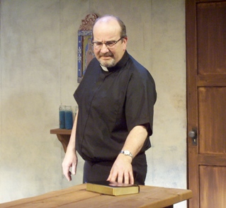 Burgess as the neurotically upbeat Father Doherty.