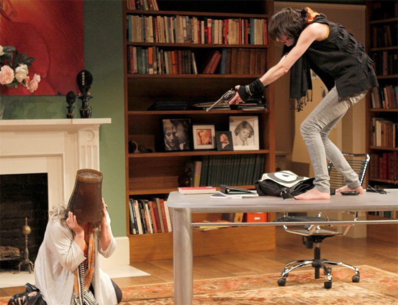 Friedman holds the gun. Hunt plays the target.