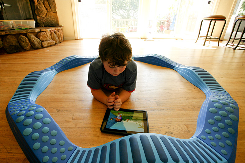 Leo has plenty of toys, including this circular balance beam, but nothing tops the iPad.