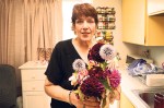 Ellen Hendrick, whose benefits have expired, is trying to make money as a freelance florist and dog trainer.