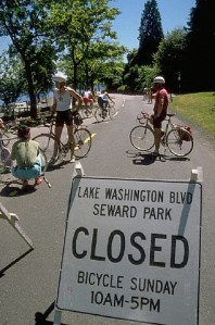 ca. 1970s-1990s, Mount Baker Beach, Seattle, Washington, USA --- Bicyclists prepare to ride along the shores of Lake Washington from Mount Baker Beach to Seward Park.  The boulevard is closed for "Bicycle Sunday" several times a summer.  Seattle, Washington, USA. --- Image by © Joel W. Rogers/CORBIS