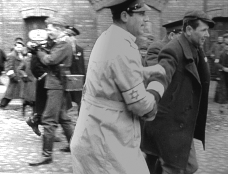 Actors to the front, actual concentration-camp inmates to the rear.