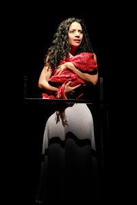 Hester (Guevara) holds her future detective daughter.