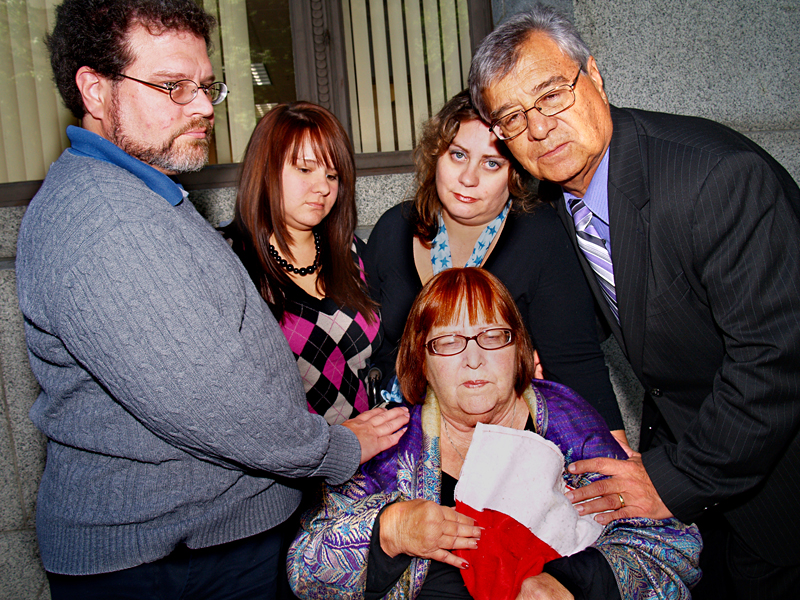 The Lopez familyincluding Patricia (center), Gerald (far right), and Lita (next to him)at the King County Courthouse for the trial six weeks ago.
