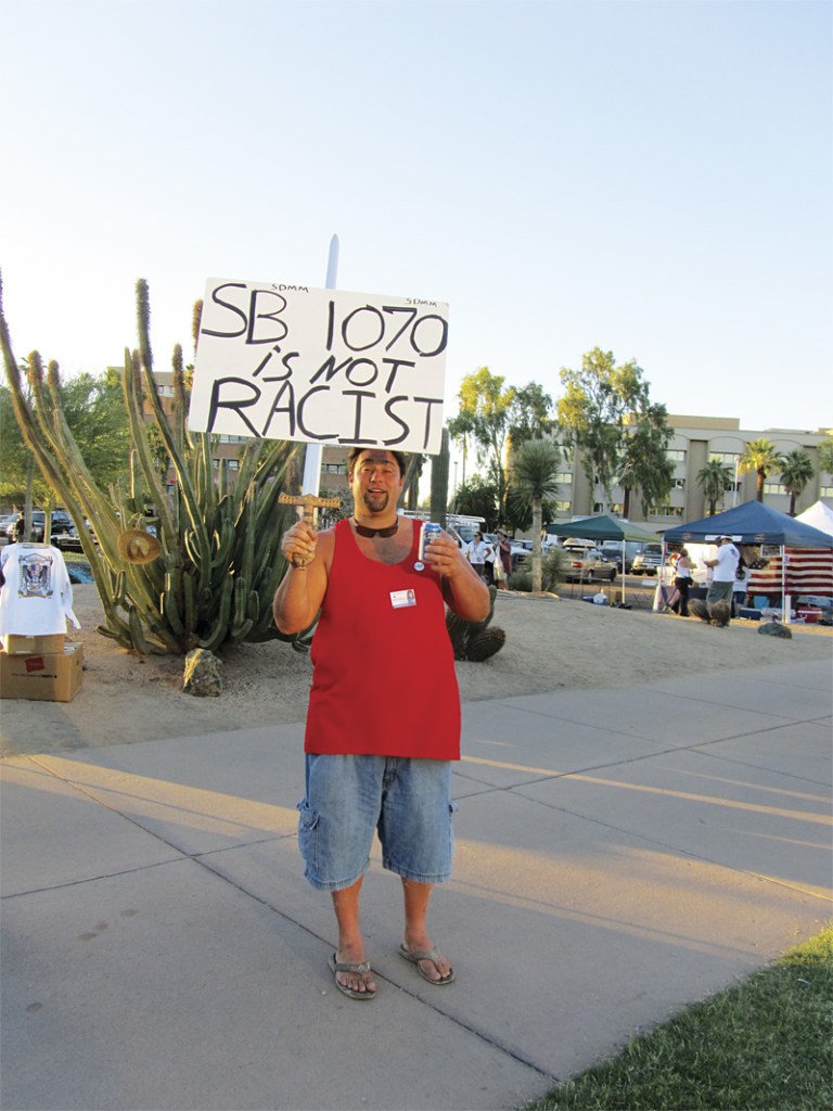 A demonstrator at the Phoenix rally speared his sign with asword.