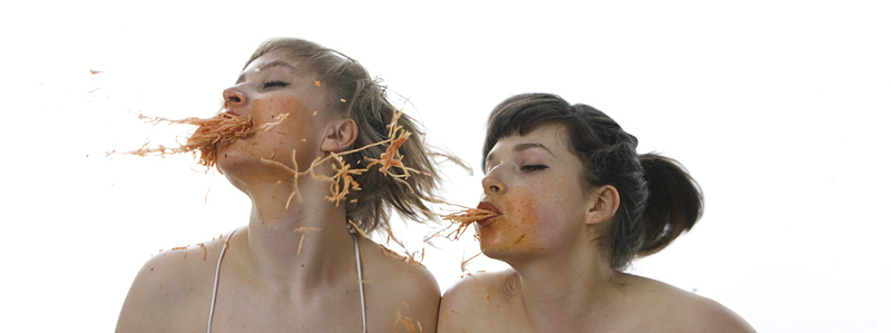 Gosti (left) and McDermott play with their food.