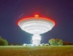 A glance at our insignificance: a rotating radio telescope, as caught by Ressmeyer.