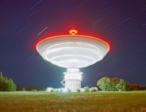 A glance at our insignificance: a rotating radio telescope, as caught by Ressmeyer.