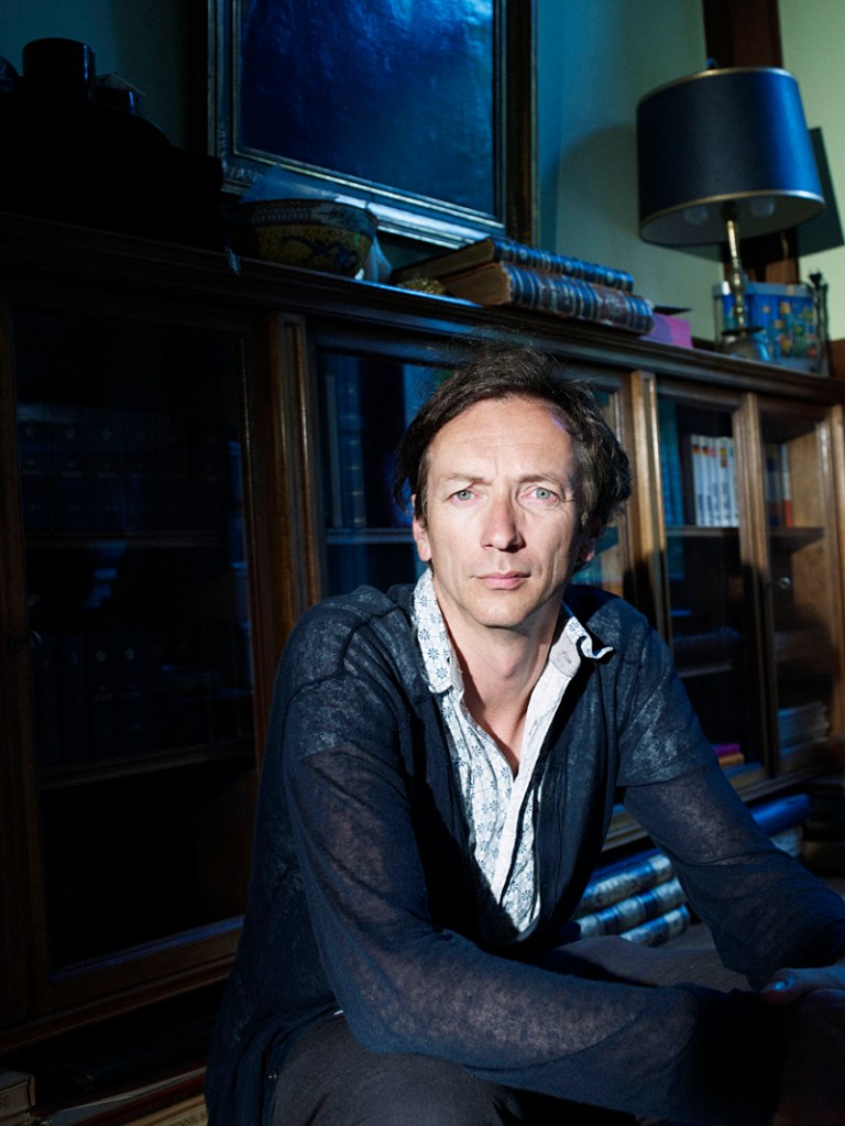 Hauschka messes with his piano.