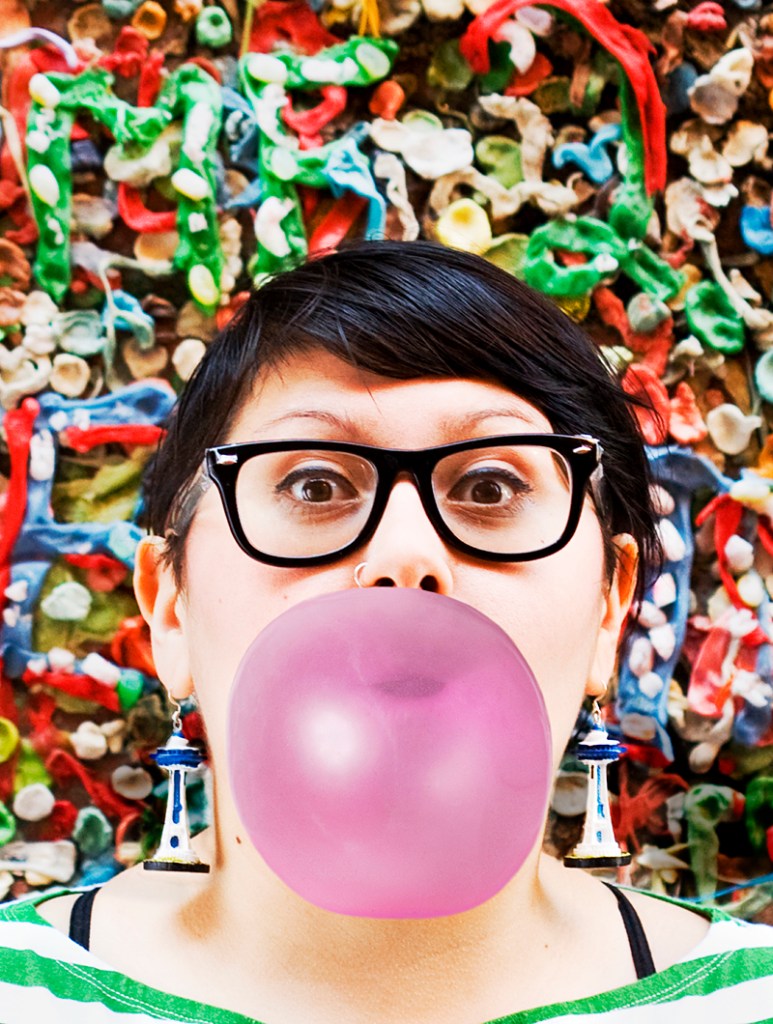 Elicia Sanchez of the arts co-op The People's Republic of Komedy, which lent us its members for a downtown photo shoot, blows one big-ass bubble.