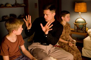 Stern patriarch Pitt, with screen sons Laramie Eppler (left) and Tye Sheridan.