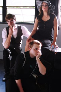 Our morose heroine (Tyrrell, with hat) and her followers.