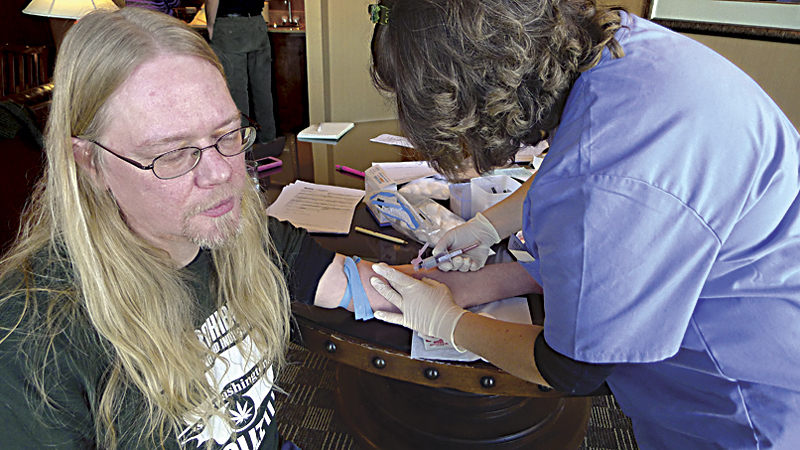 Troy Barber gets blood drawn.