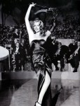 Hayworth doing her famous striptease.