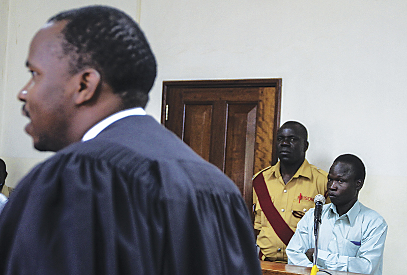 Kwoyelo, shown awaiting trial in northern Uganda, was abducted before he reached puberty.