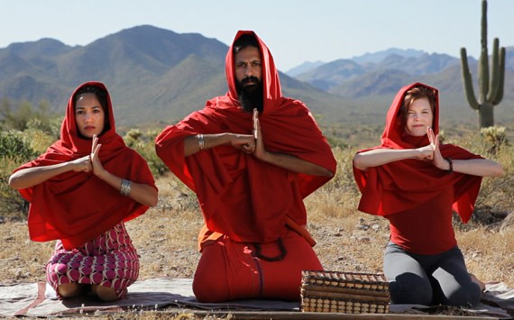 The director (center) as fake cult leader.