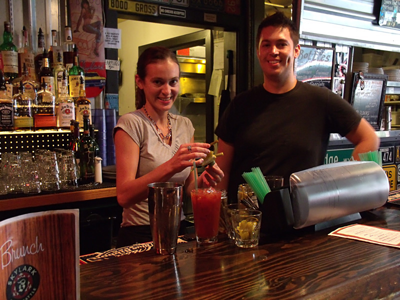 Sister and brother, behind the bar.