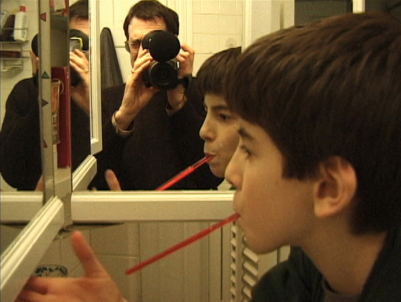 The father films his young son.