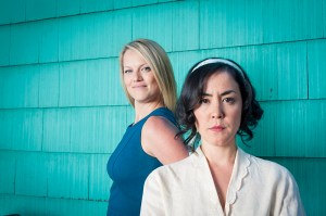 Olson (foreground) and Lass as rival sibs.