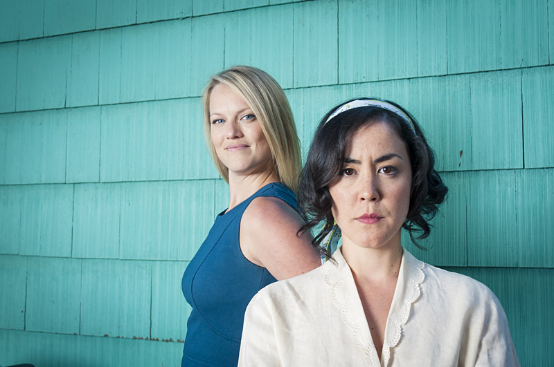 Olson (foreground) and Lass as rival sibs.