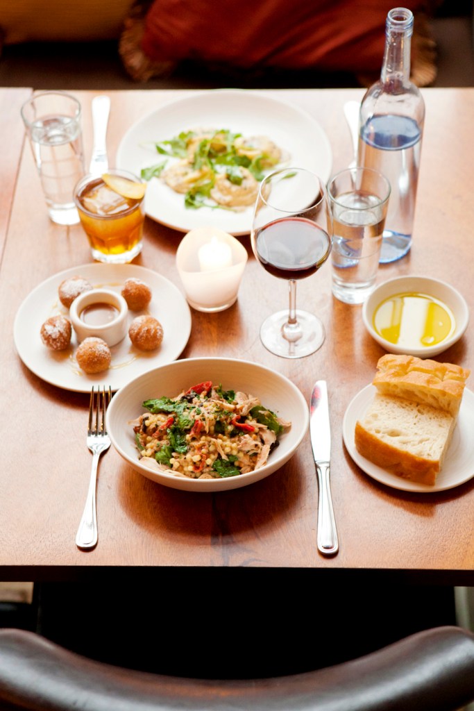 From the vantage point of a table set with drinks and a few slices of rustic housemade focaccia, it seems impossible for the evening to go awry. Top left: house-cured pork loin. Bottom left: cauliflower soup.