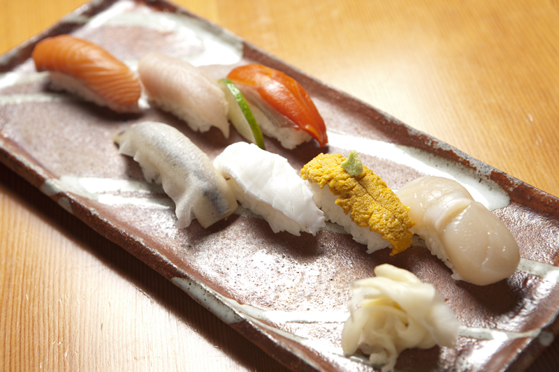 Sushi assortment of sea scallop, sea urchin, Columbia springer, copper liver, sockeye, herring, and albacore tuna belly