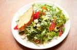 A spunky arugula salad dressed with blood orange segments and ricotta salata should also keep spirits up.