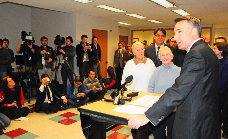 King County Executive Dow Constantine counts down the seconds until midnight.