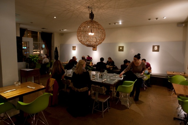 GrubaE™s the kind of neighborhood restaurant where diners show up in yoga clothes and share a carafe of red wine.