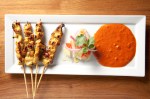 Eaters who've soured on moo satay will appreciate May's cliche-wrecking version of grilled pork skewers, supple and rich from a swim in a curry propped up by coconut milk.