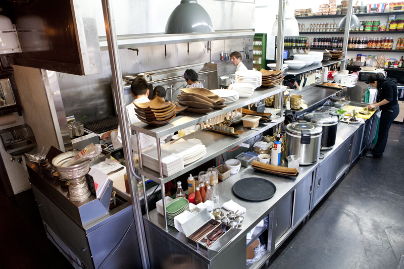 The back door leading to Chaleoy's genuinely open kitchen is the entryway likely to garner the most attention. Designed to mitigate customer traffic once the restaurant adds take-out to its repertoire, the door is now available to anyone who wants to peer at the tidy line and absorb the hushed rhythms of sauce-stirring and noodle-garnishing. And May's cooks won't mind if your admiration for a meticulous rear-wall pantry arrangement of fish sauce bottles and coconut milk cans inspires you to reach for your camera.