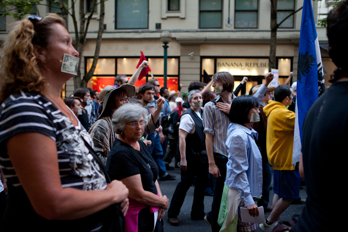 Occupy Seattle held a Silent Flash March at Westlake Park Monday -