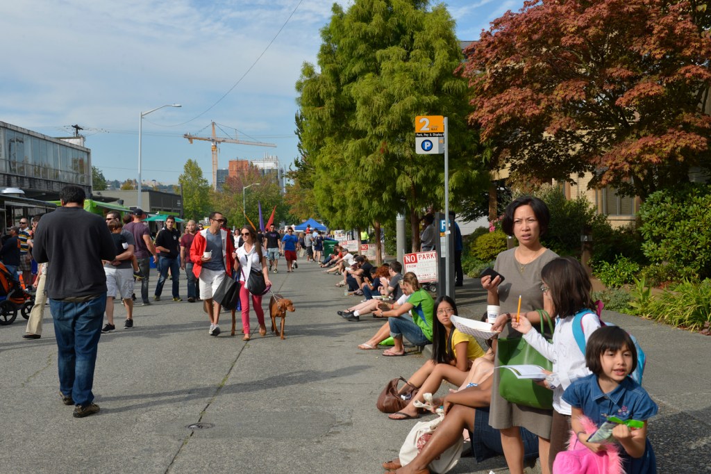 Foodies enjoying lunch on the sidewalk