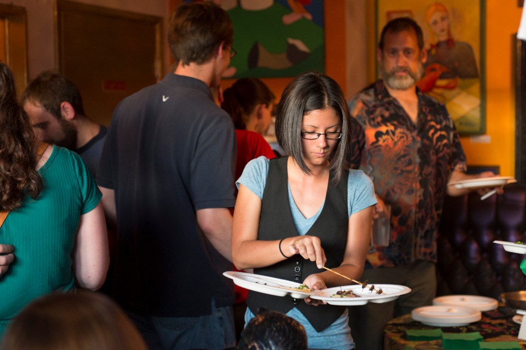 Helping herself to some cricket kabobs.