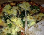 The Roman: The third-favorite dish of Seattle Weekly restaurant critic Hanna Raskin, it's covered with mozzarella and pecorino cheeses, then garnished with spinach leaves and papery panes of artichoke heart. Read more: 100 Favorite Dishes: The Roman at The Independent Pizzeria