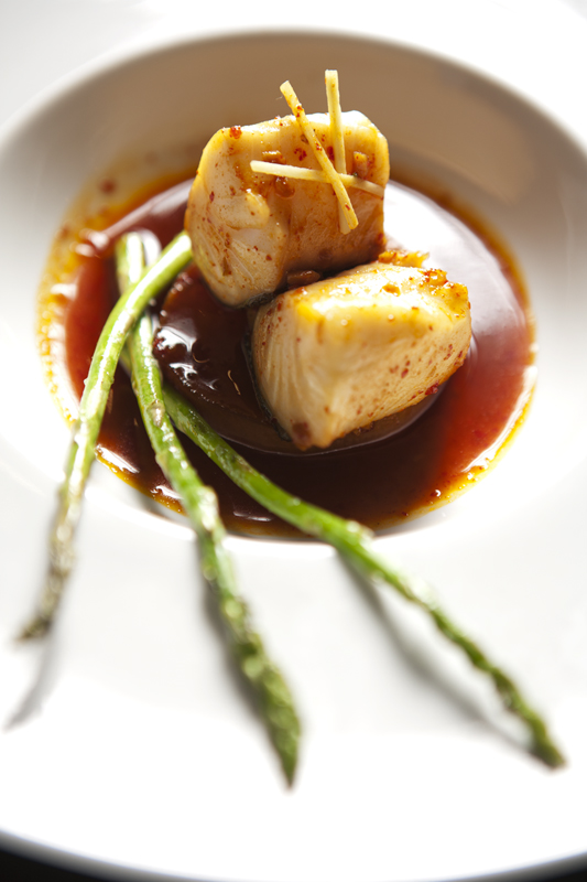 The grilled asparagus spears served with a slippery hunk of black cod flaking over a sweet wheel of daikon are just as good as the plush fish that's the star of the plate.