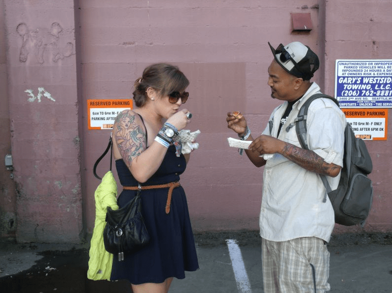 Nemencio and Chelsea from Seattle are here for Aesop Rock and pork thataE™s been smoked for 10 hours from Off the Rez.