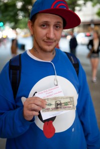 On July 4, the activist group #MicCheckWallSt threw 5,000 $1 bills off