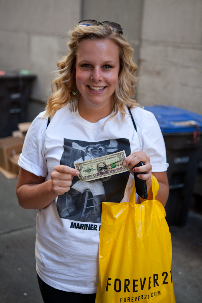 On July 4, the activist group #MicCheckWallSt threw 5,000 $1 bills off