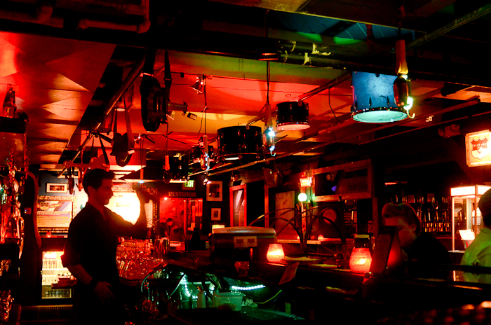 The bar, lit by fixtures made from old drum-kits, work-lights, and beer bottles.