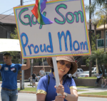 The sign of a happy family at the Long Beach pride parade.