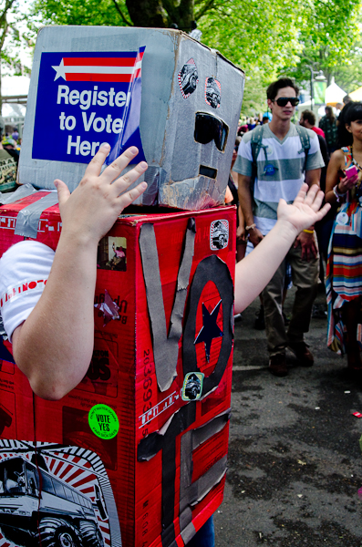 A vote-bot, a member of one of the many organizations canvassing the event.