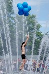 A man who managed to clamber atop the International Fountain received a resounding cheer.
