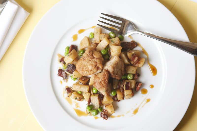 The plump sweetbreads are crisped just enough to contextualize their starkly fabulous creaminess, which lolls deliciously on the tongue. A spray of apple gastrique gives the appetizer a honeyed flavor, but the sweetness is balanced by salty capers and the plate's central clump of bitter, woodsy frisee.